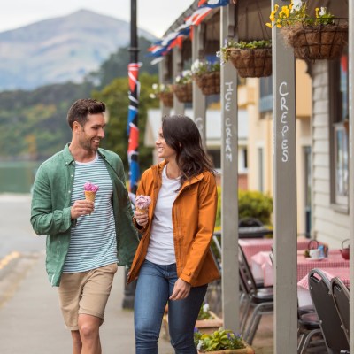 a couple walking and eating ice cream