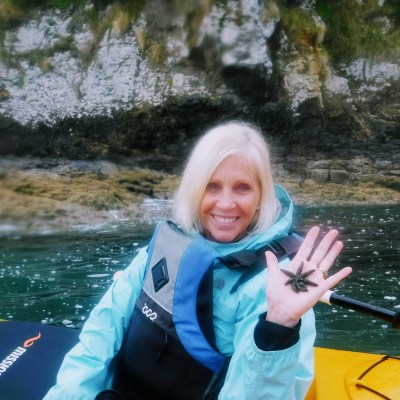 woman holding a starfish